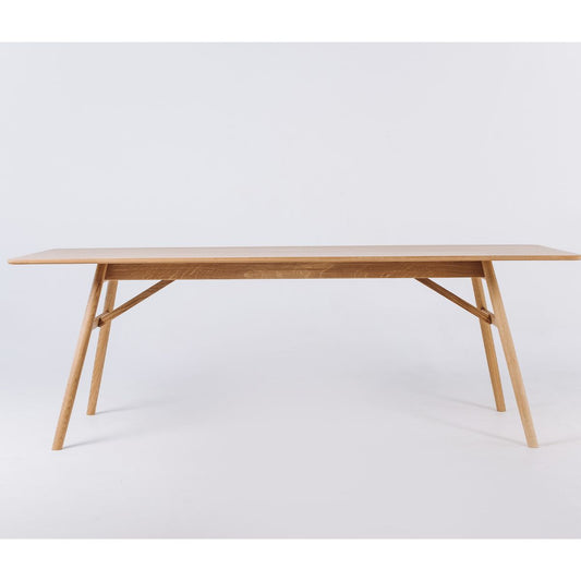 Rectangular wooden dining table tabletop detail with natural oak veneer